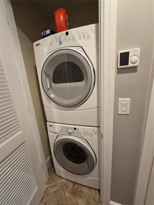 Utility closet for stackable washer & dryer.