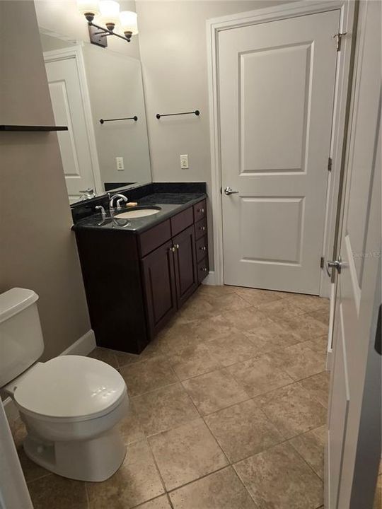 Full bath with walk in closet.