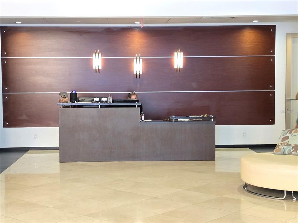 Lobby Concierge Desk center to both North & South Elevators & Mailbox spaces.