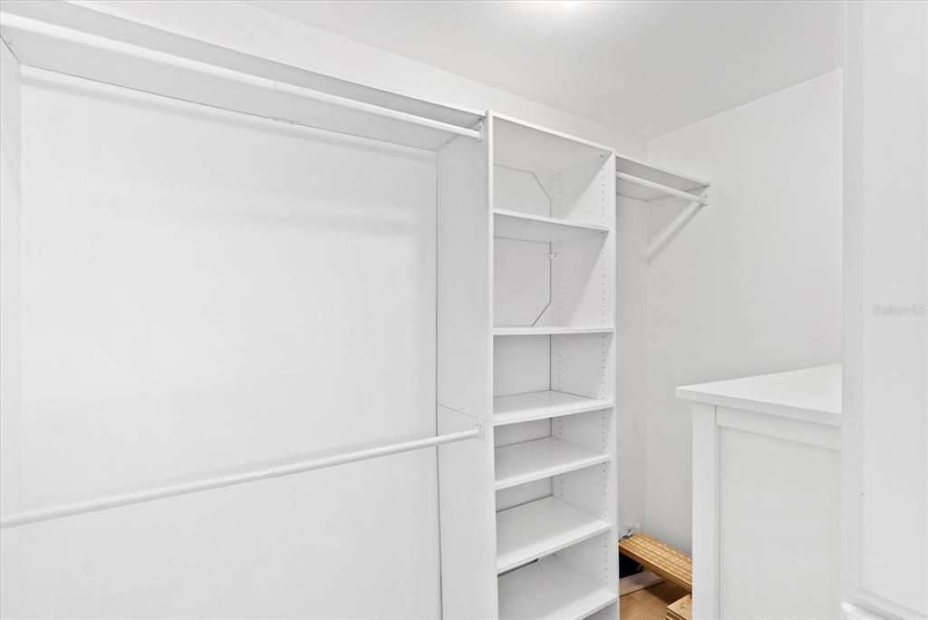 Primary bedroom walk-in closet.