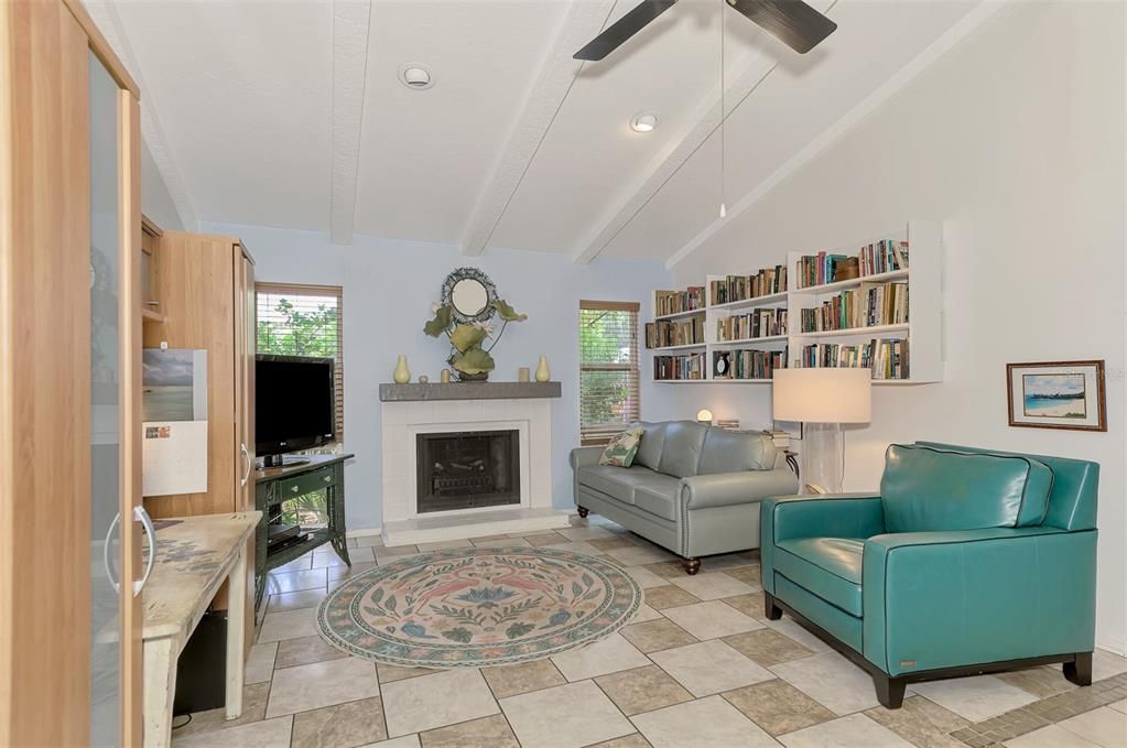 Inviting living room with a cozy fireplace. Relax and unwind in this spacious and comfortable space, perfect for entertaining or enjoying quiet evenings at home.