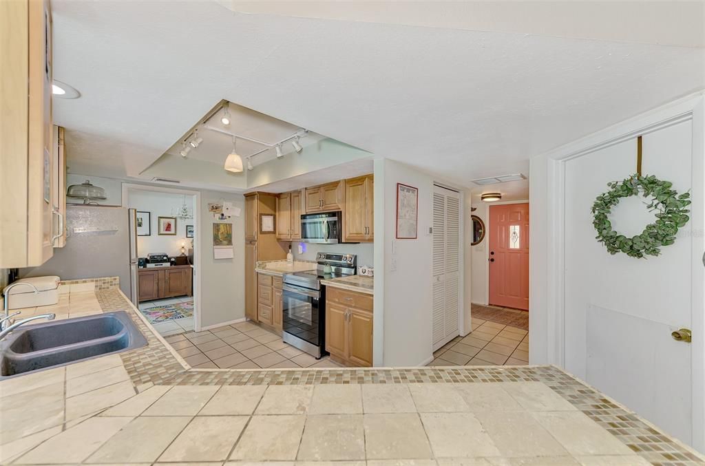 Spacious kitchen with ample counter space and storage. Enjoy cooking and entertaining in this bright and functional space.