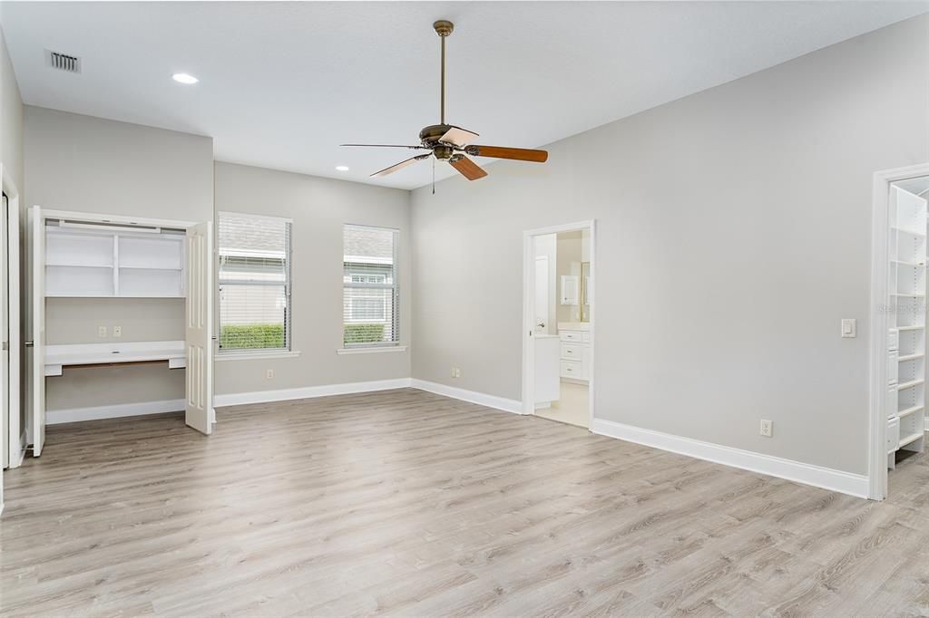 Primary Bedroom (15' x 25') This generously sized Primary Bedroom has two walk in closets, a custom built in desk area and a spacious en-suite bathroom (12' x 12'), also with custom storage