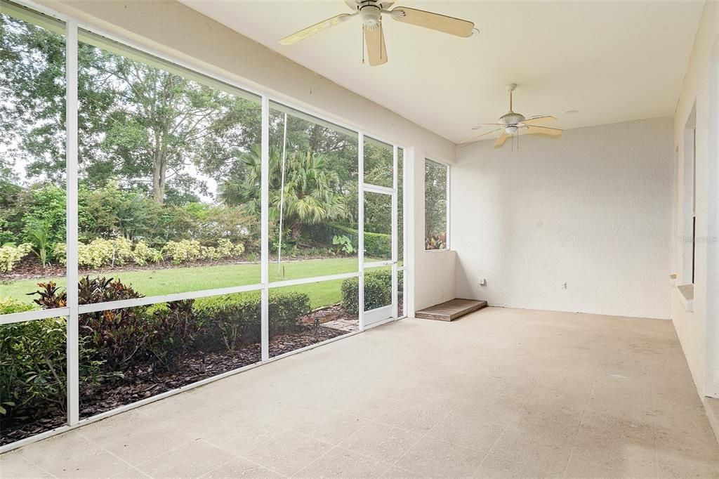 Back Patio (12' x 27')  Screened in patio, with ceiling fans. Accessible through Double French Doors from the main house.