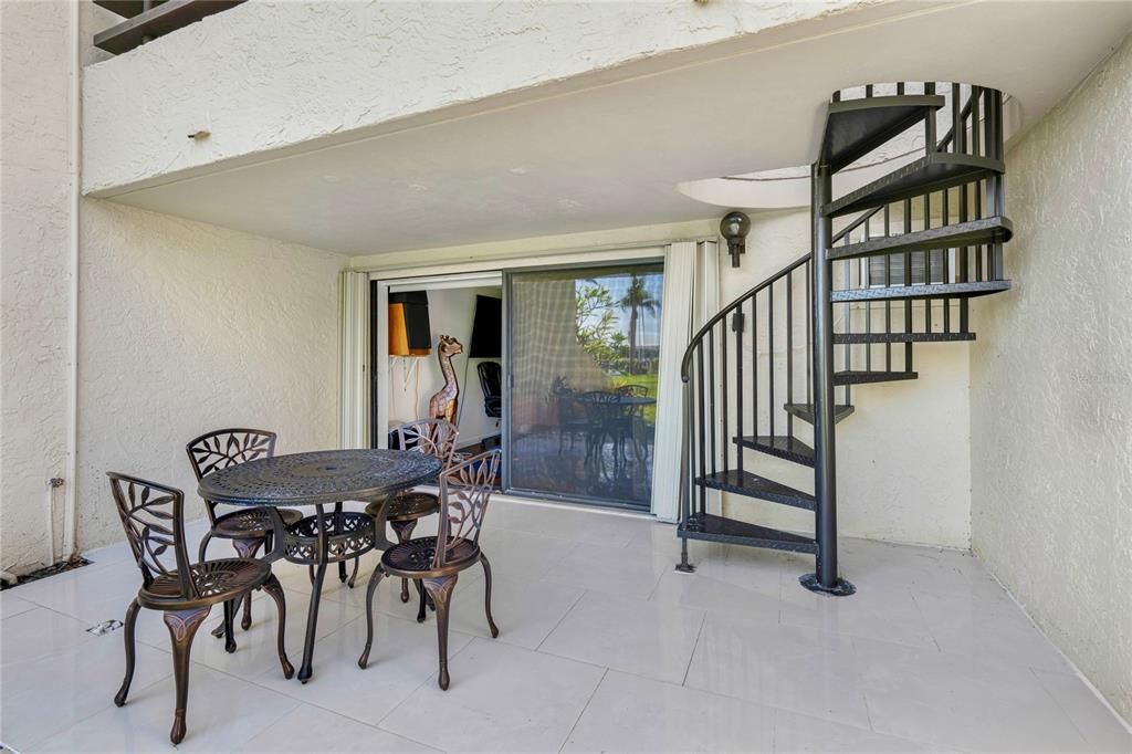 Patio with stairs to 2nd floor balcony