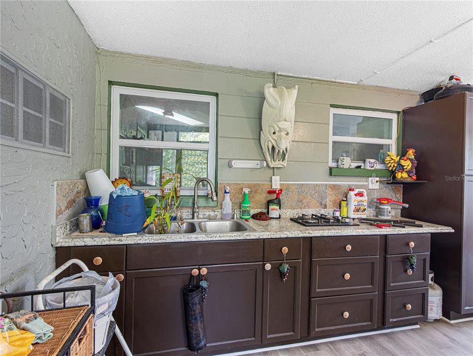 outdoor full kitchen - propane - updated flooring, fully screened - great entertaining space