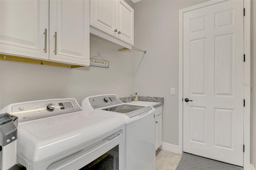 Laundry Room leading to 3 car garage