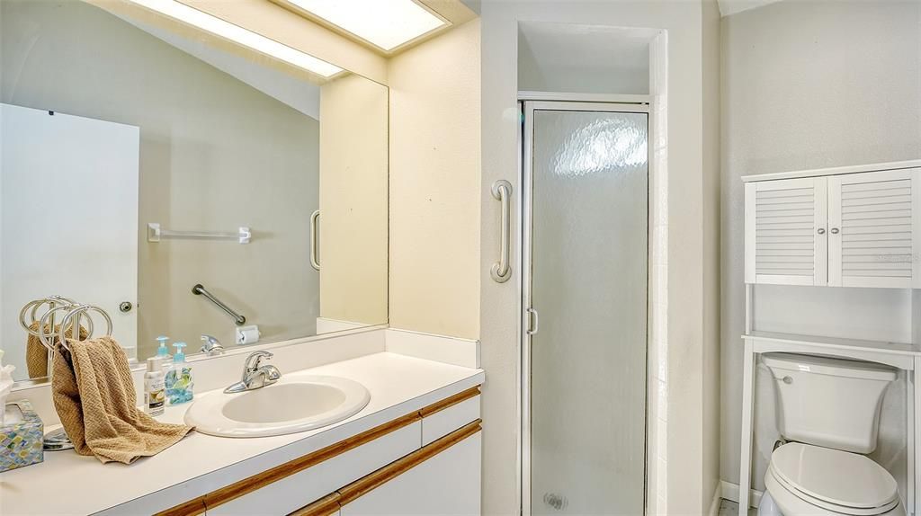 Primary Bath with walk-in shower.  Newer comfort height toilet.