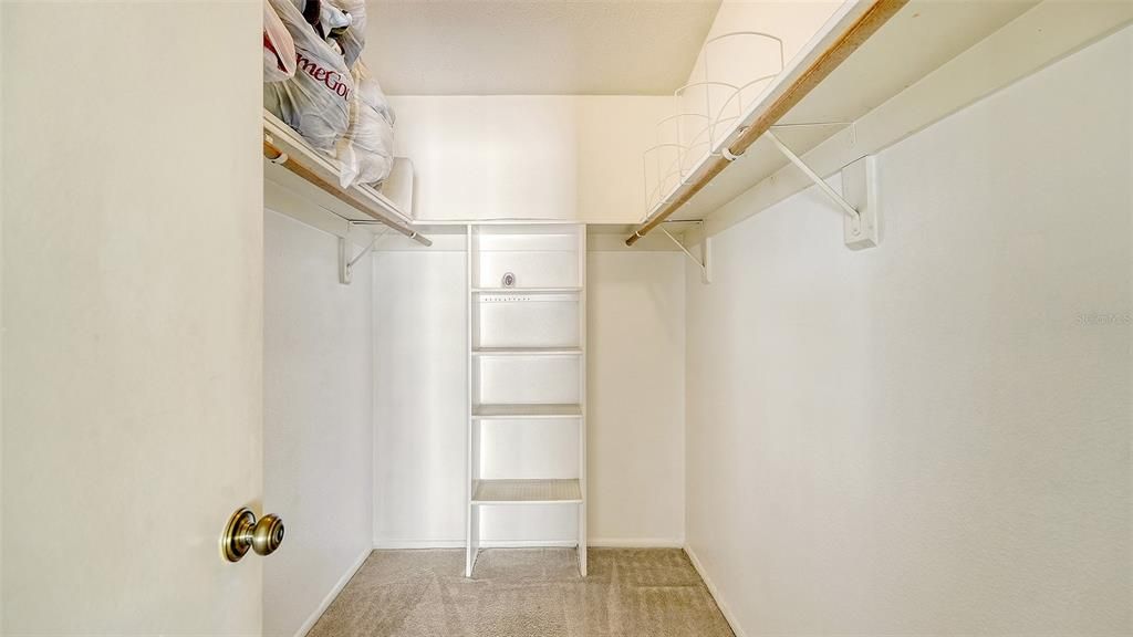 Primary bedroom walk-in closet.