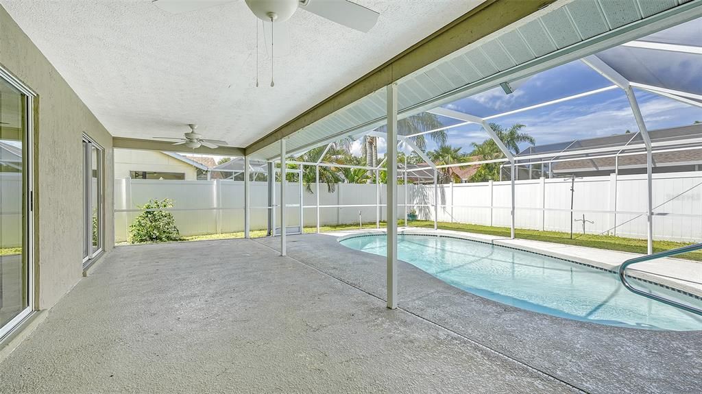 Spacious lanai and pool area.  Lanai is accessible from Primary Bedroom, Dining Area, and Family Room.