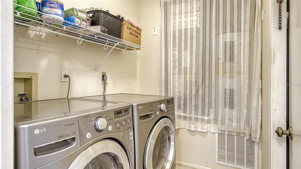 Laundry Room.  AC air handler is at the end of the room.  AC was installed in 2023.