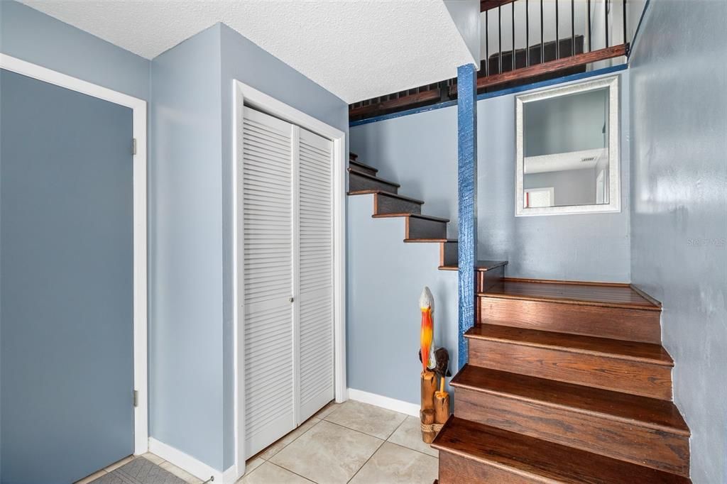 Coat Closet and stairs leading to 2nd floor