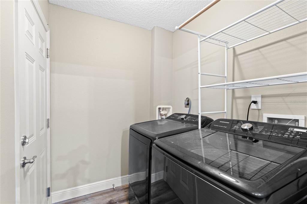 Indoor utility room.  Washer & Dryer stay!