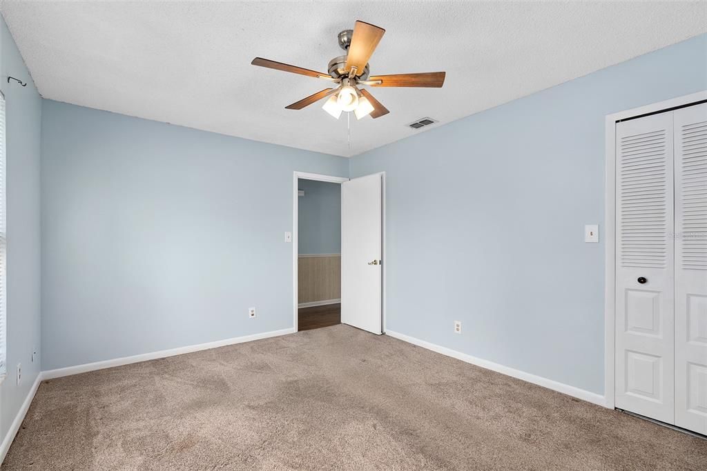 master bedroom downstairs. behind the bedroom door is a pocket door to bathroom