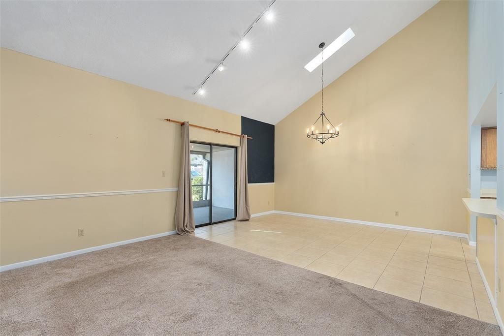 family room with vaulted ceilings