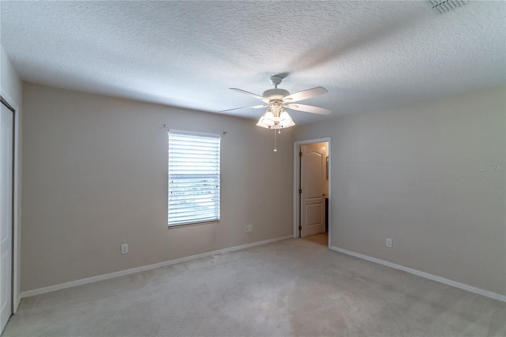 upstairs bedroom with attached bathroom