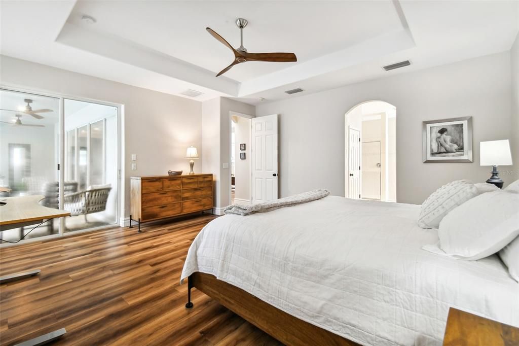 Primary Bedroom with private access to Pool and Lanai