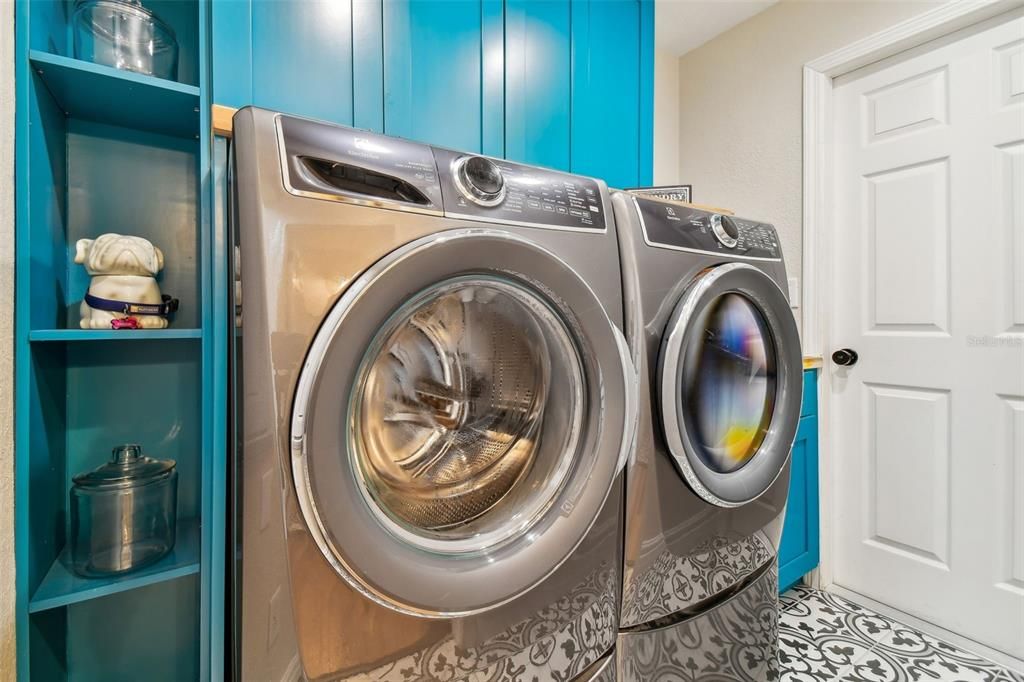 First FloorLaundry room with custom cabinetry and sink