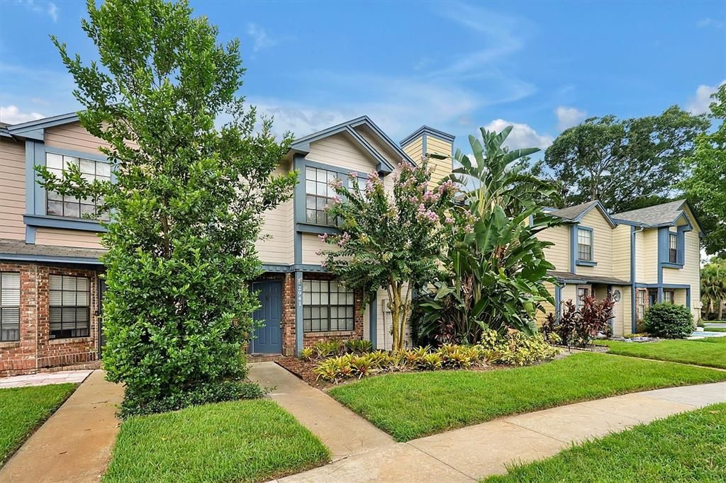 Lovely landscaped front entrance welcomes you and your visitors home.  The irrigation is included in your hoa fees.  A great savings to your water bill.  Much of the siding has been replaced with concrete board. And the brick front adds a beautful addition.