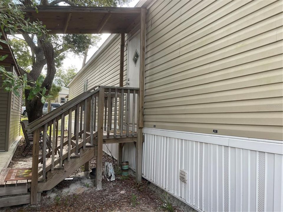 Stairs that lead to back porch