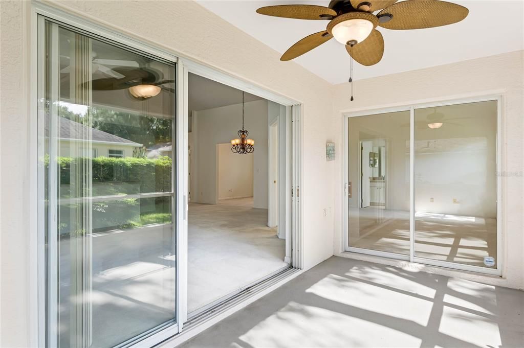 Screened rear patio complete with ceiling fan