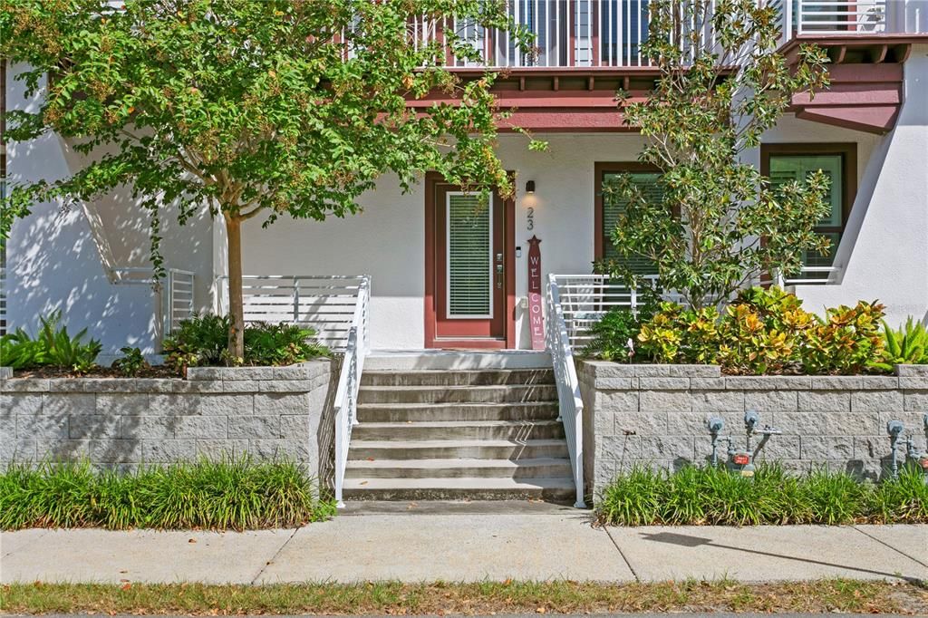 West facing Front porch entrance with hurricane impact windows and doors