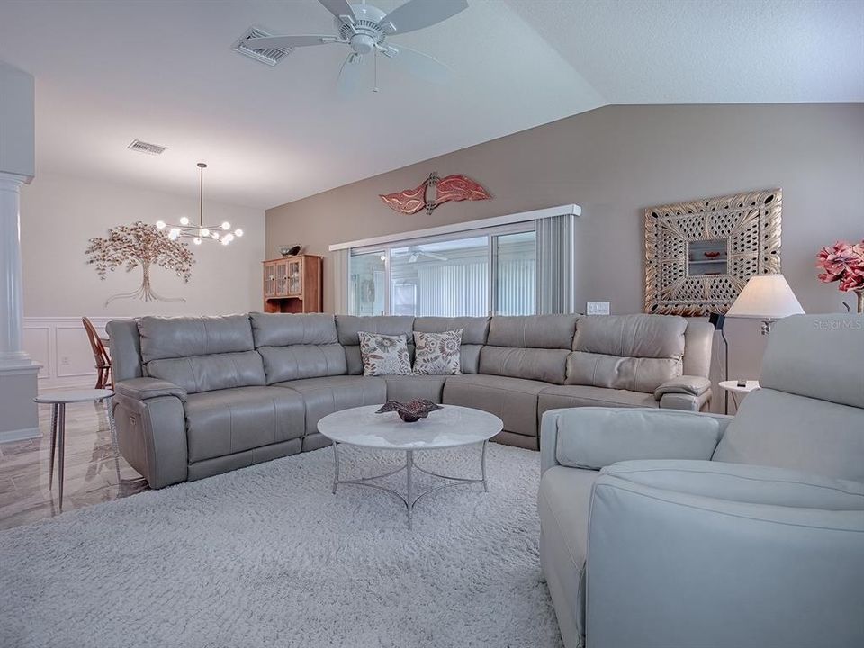 LOVELY SPACIOUS LIVING ROOM WITH KNOCKDOWN VAULTED CEILINGS.