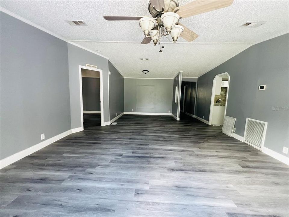 VIEW FROM SLIDING GLASS DOORS OF FORMAL LIVING AND DINING ROOM