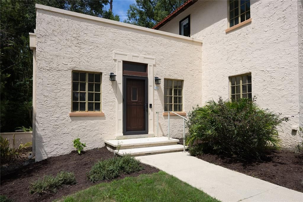 Stucco exterior with rooftop terrace