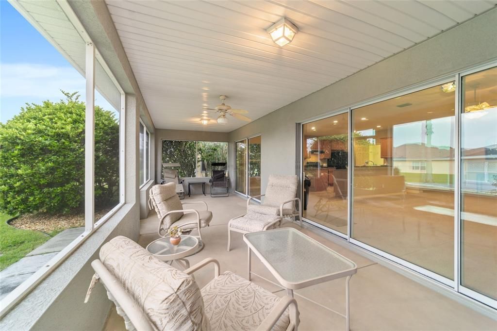 Covered rear screen in porch. Triple slider into the living room and double into the breakfast nook.