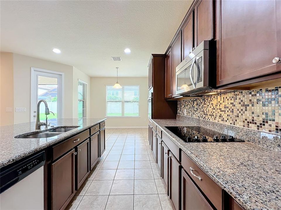 Gourmet kitchen with custom backsplash