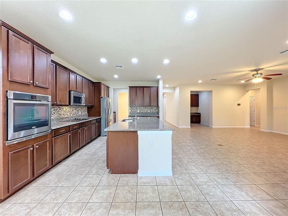 The kitchen flows seamlessly into the family room and dinette area