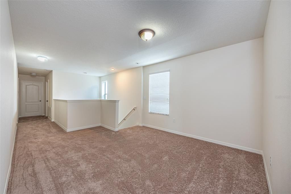 Bonus Room loft at the top of the stairs