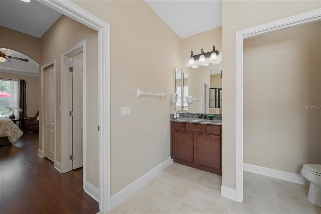 Double vanities and private water closet in the master bathroom