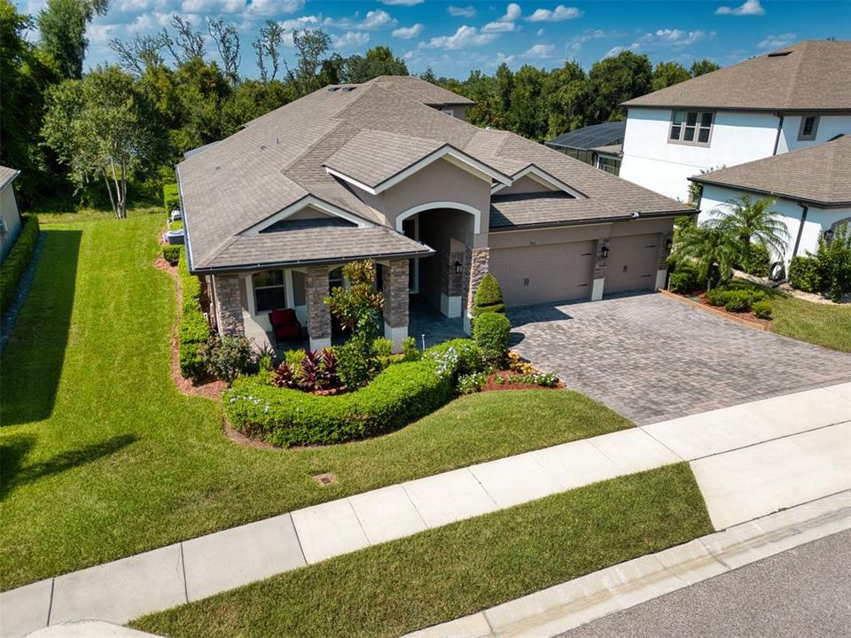 Gorgeous curb appeal with pristine landscaping