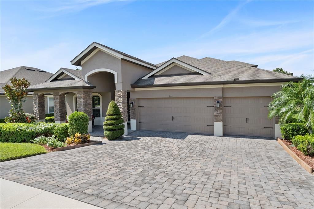 Three car oversized garage with paved driveway. Use one garage for your golf cart in  the prestigious Golf Community of Heathrow