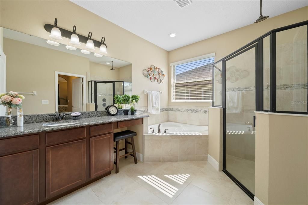 Ensuite master bath includes a walk-in shower and garden tub