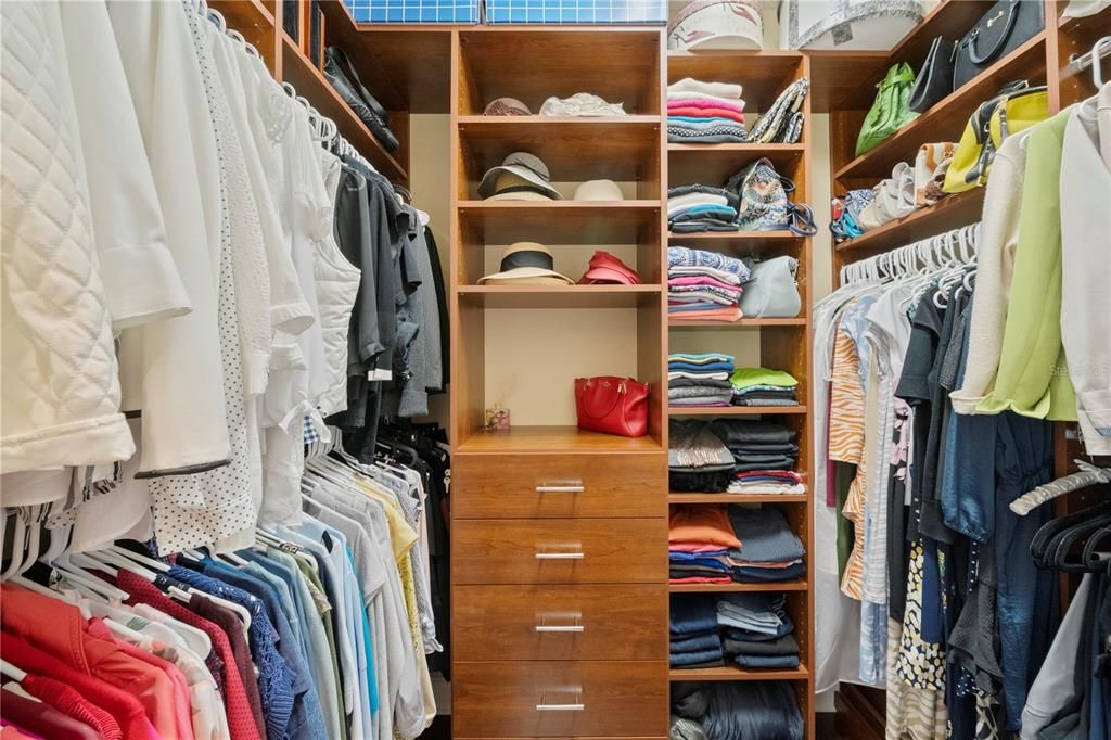 His/her custom closets in the primary bedroom