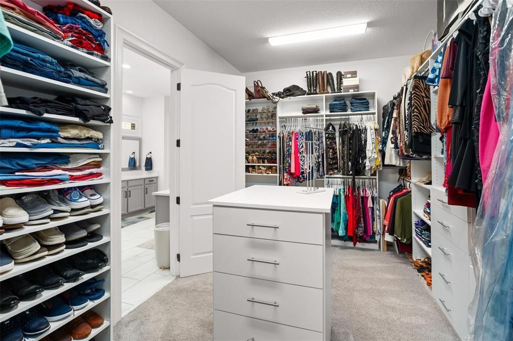 Custom California Closets in primary closet.