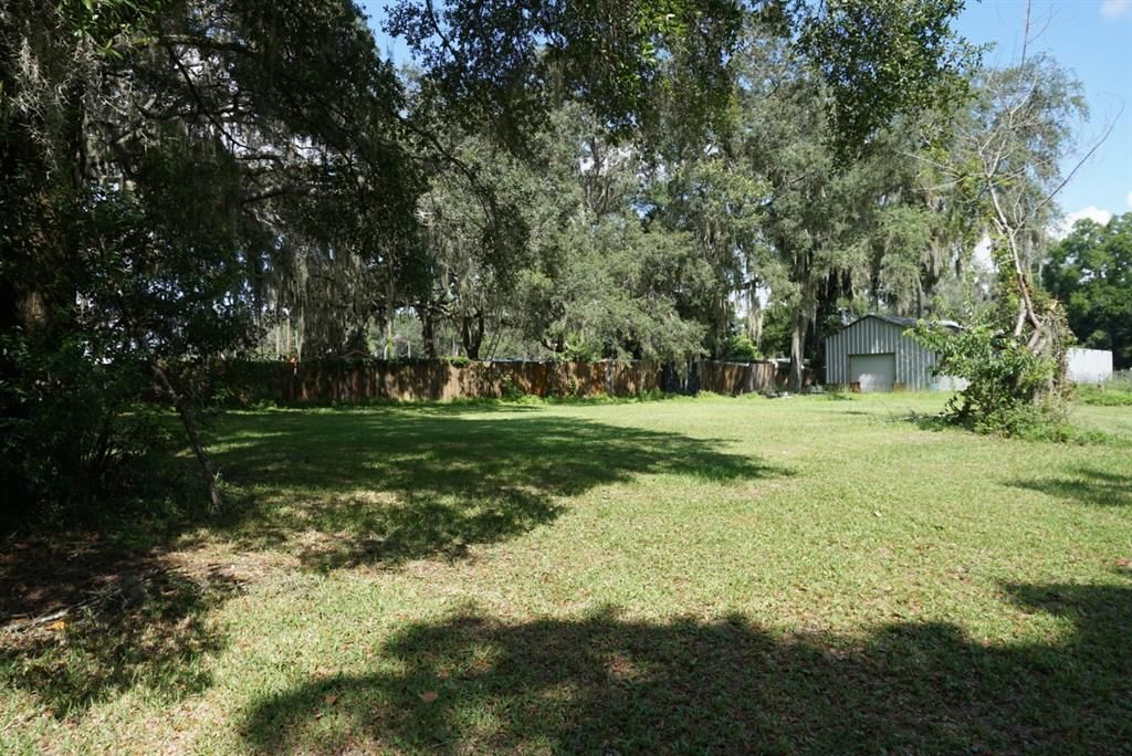 Fence and shed area beside main property