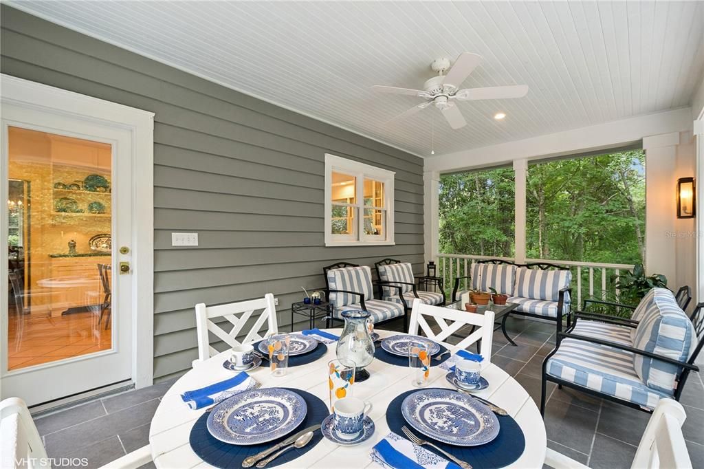 Outdoor dining on screened porch off kitchen