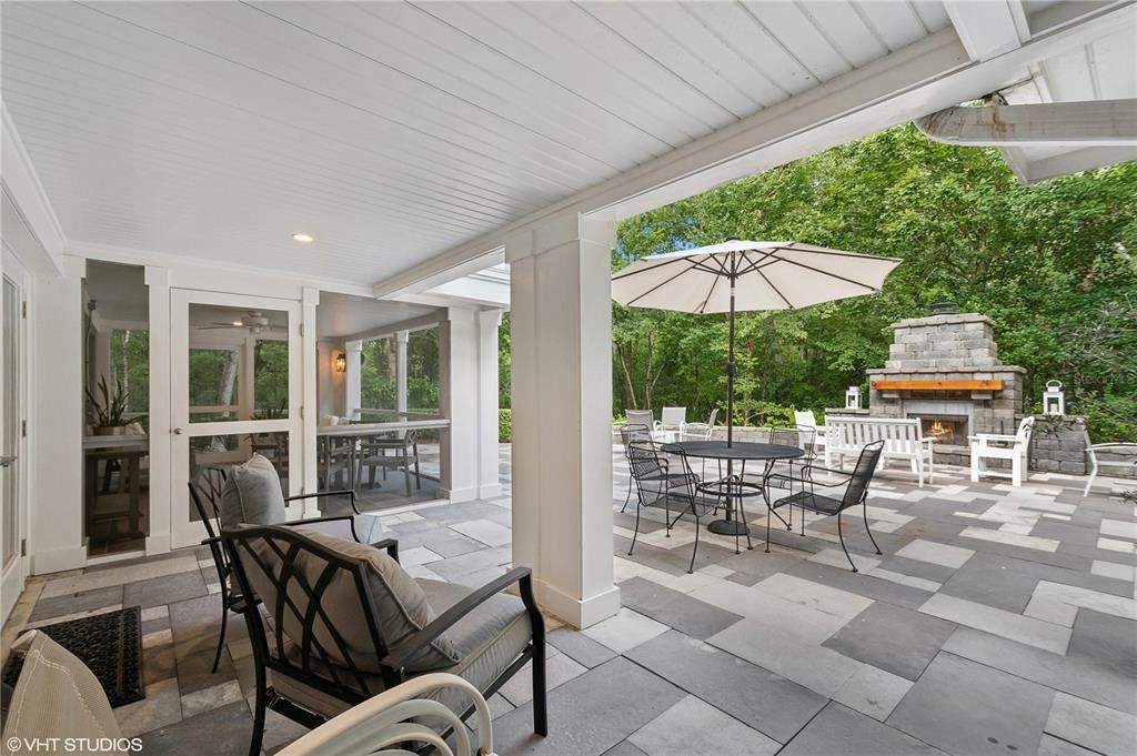 Open porch to outdoor fireplace