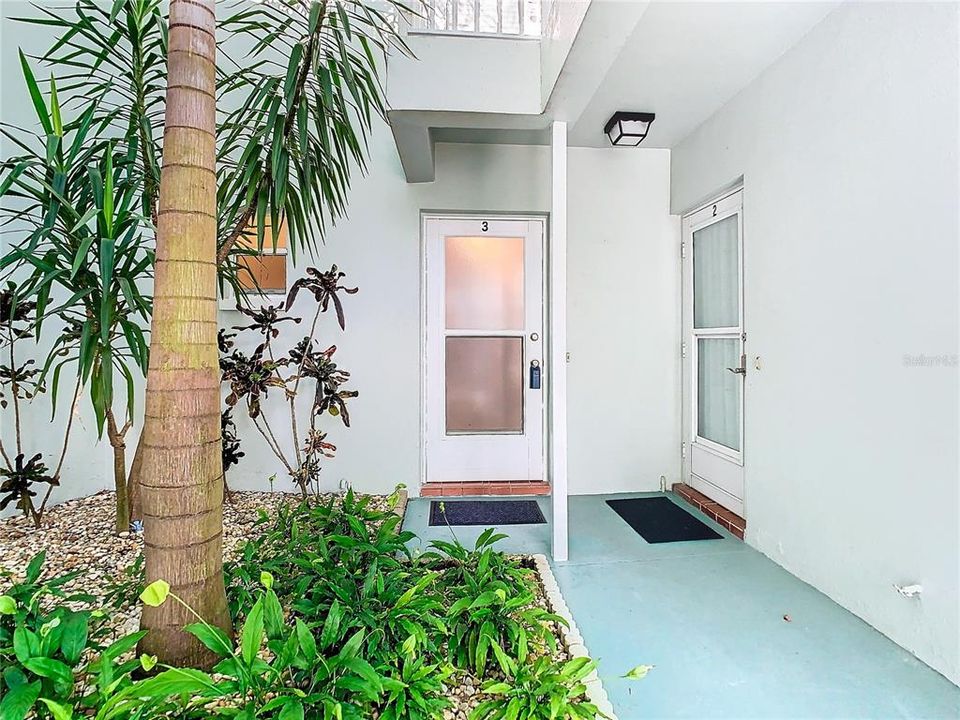 Zen-like garden area at the semi-private entrance (The door with the lockbox is unit #3)