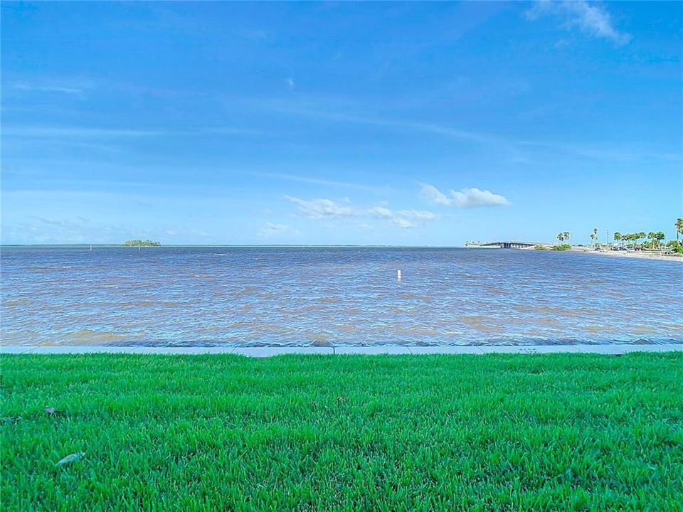 View due west from just outside the screened patio. beach to the right.