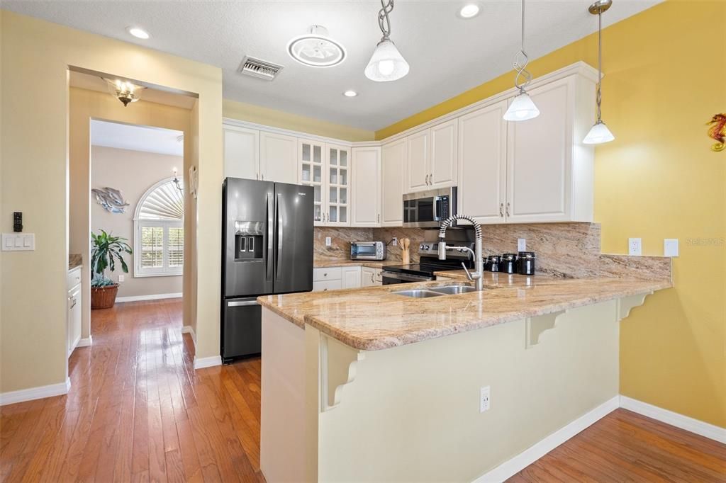 Beautiful updated kitchen with 42" cabinets, granite countertops and black stainless appliances