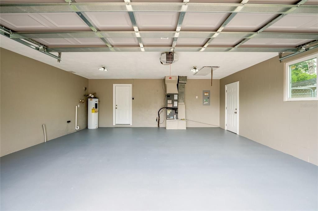 New garage door and freshly painted garage floor