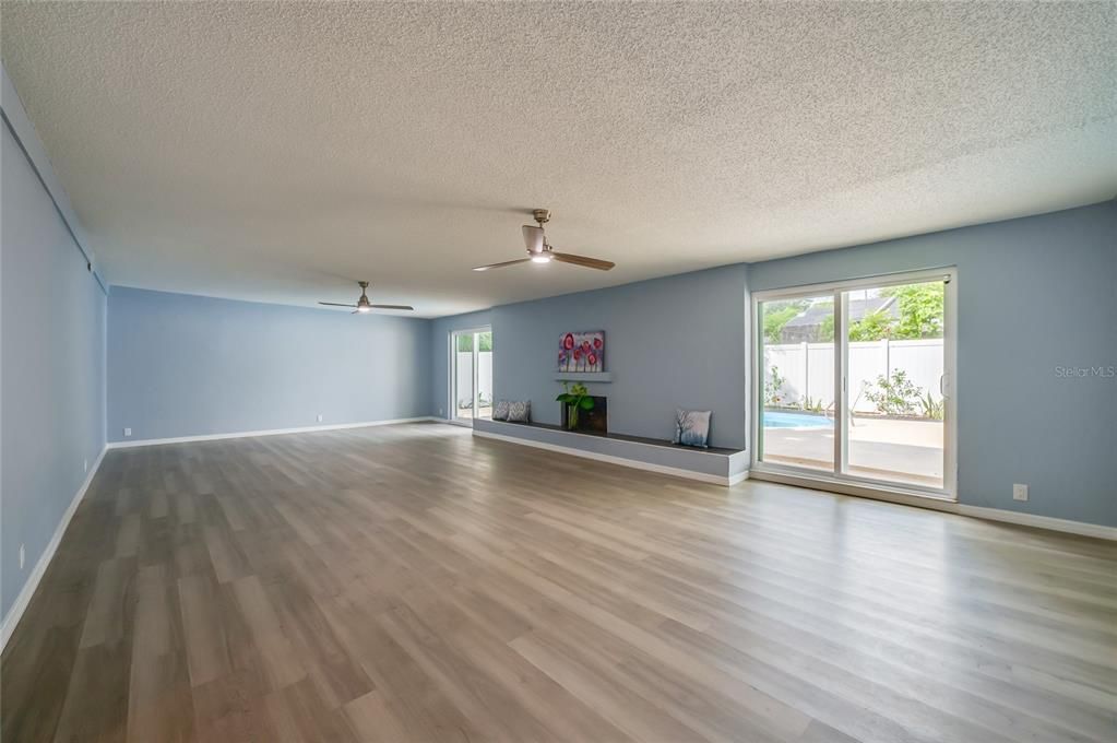 Huge family room with wood-burning fireplace