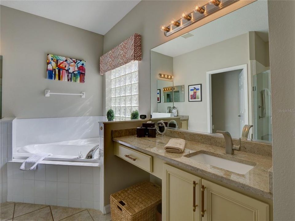 Primary Bathroom with Dual Sinks, Granite Counters and Garden Bath