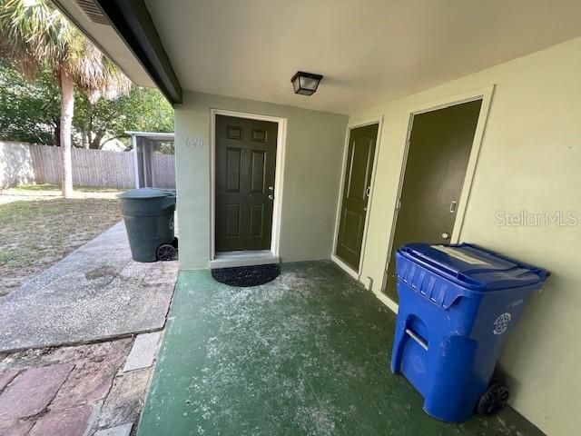 Storage units outside the front door off of the carport