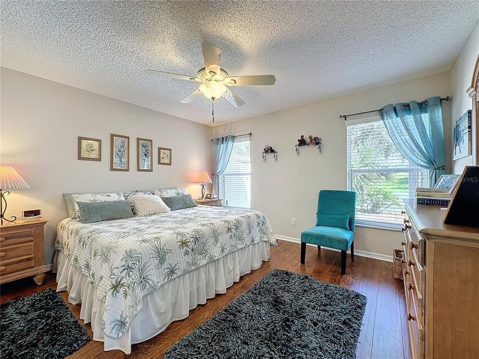 Primary  bedroom has laminate flooring